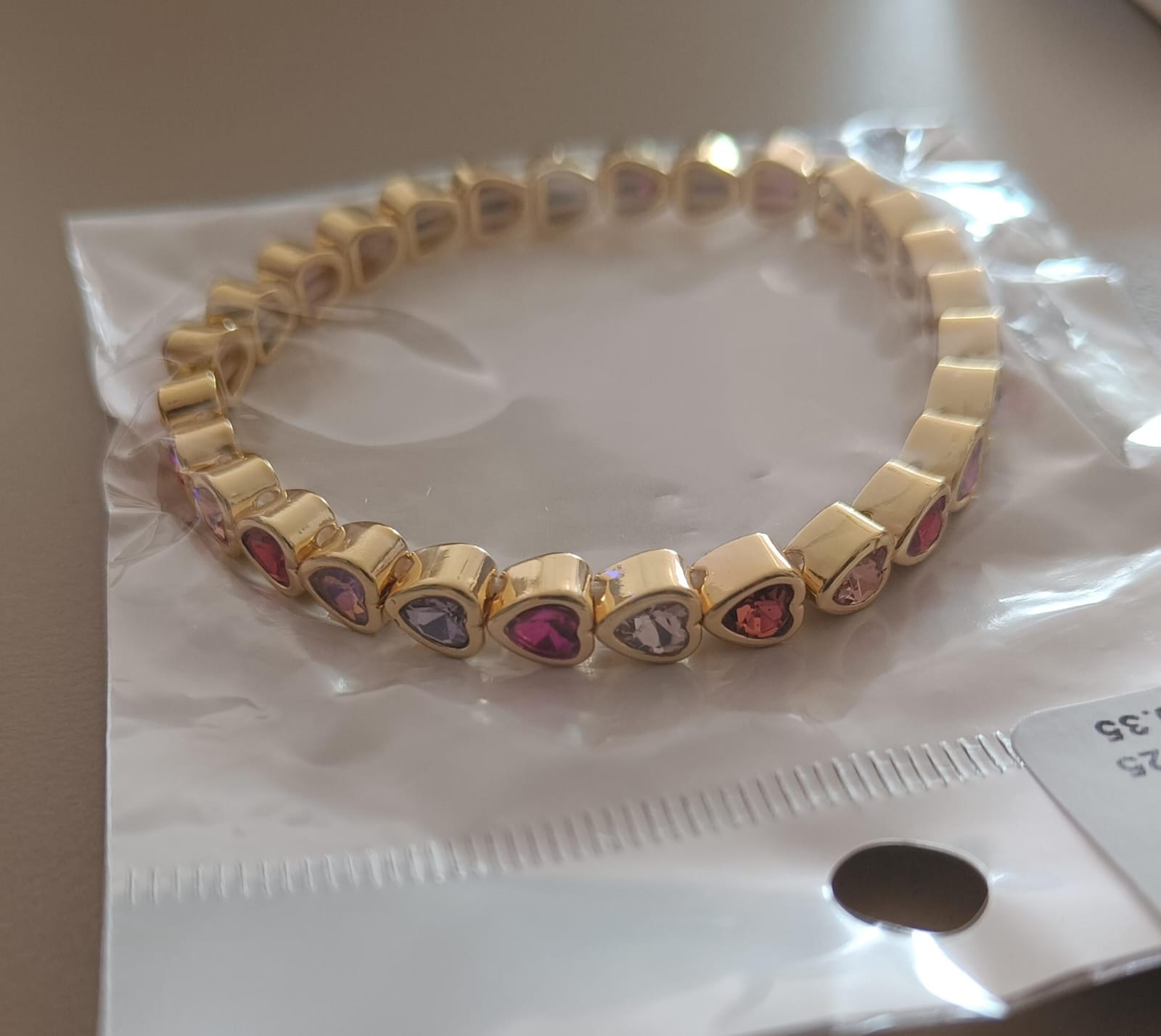 BRAZALETE CORAZON TONOS ROSADO ZIR. LAMINADO